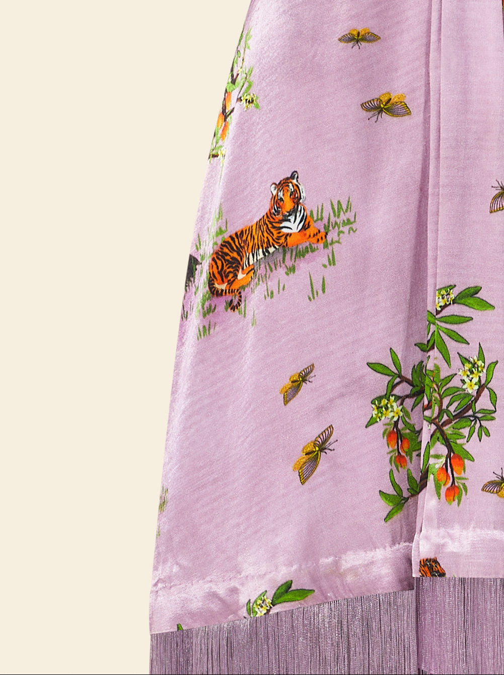 Purple fabric with tiger and butterfly print on a light yellow background