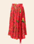 Red skirt with floral and bird pattern on a beige background