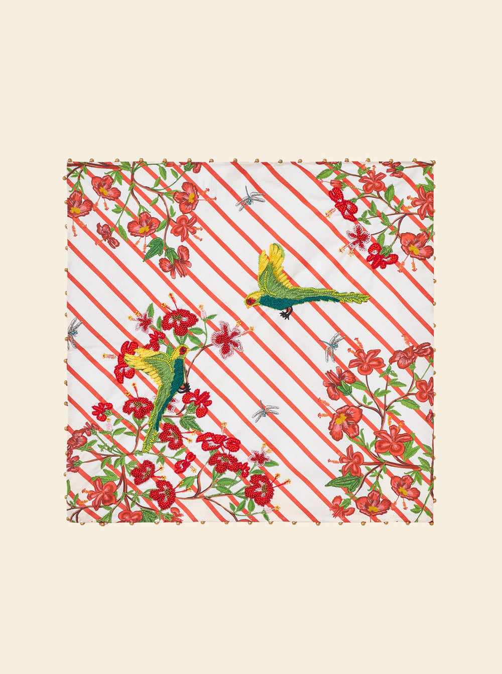 Patterned fabric with red and green design on a beige background