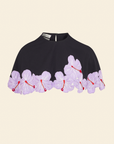 Black cape with purple and pink hibiscus flower applique along the bottom edges