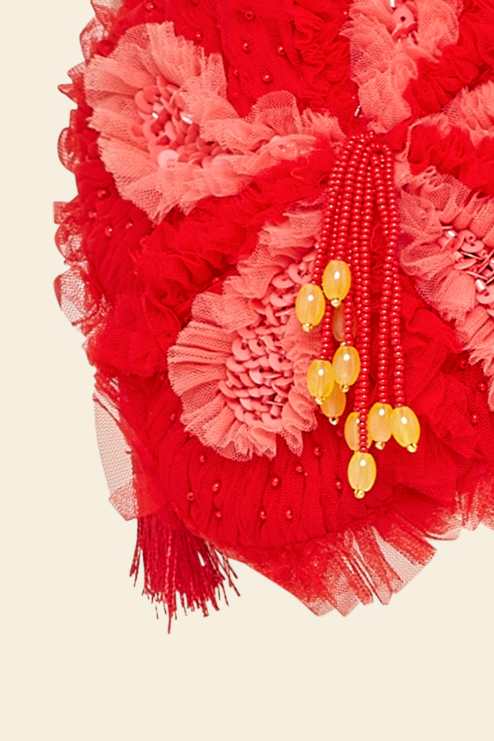 closeup of red fabric floral with beads