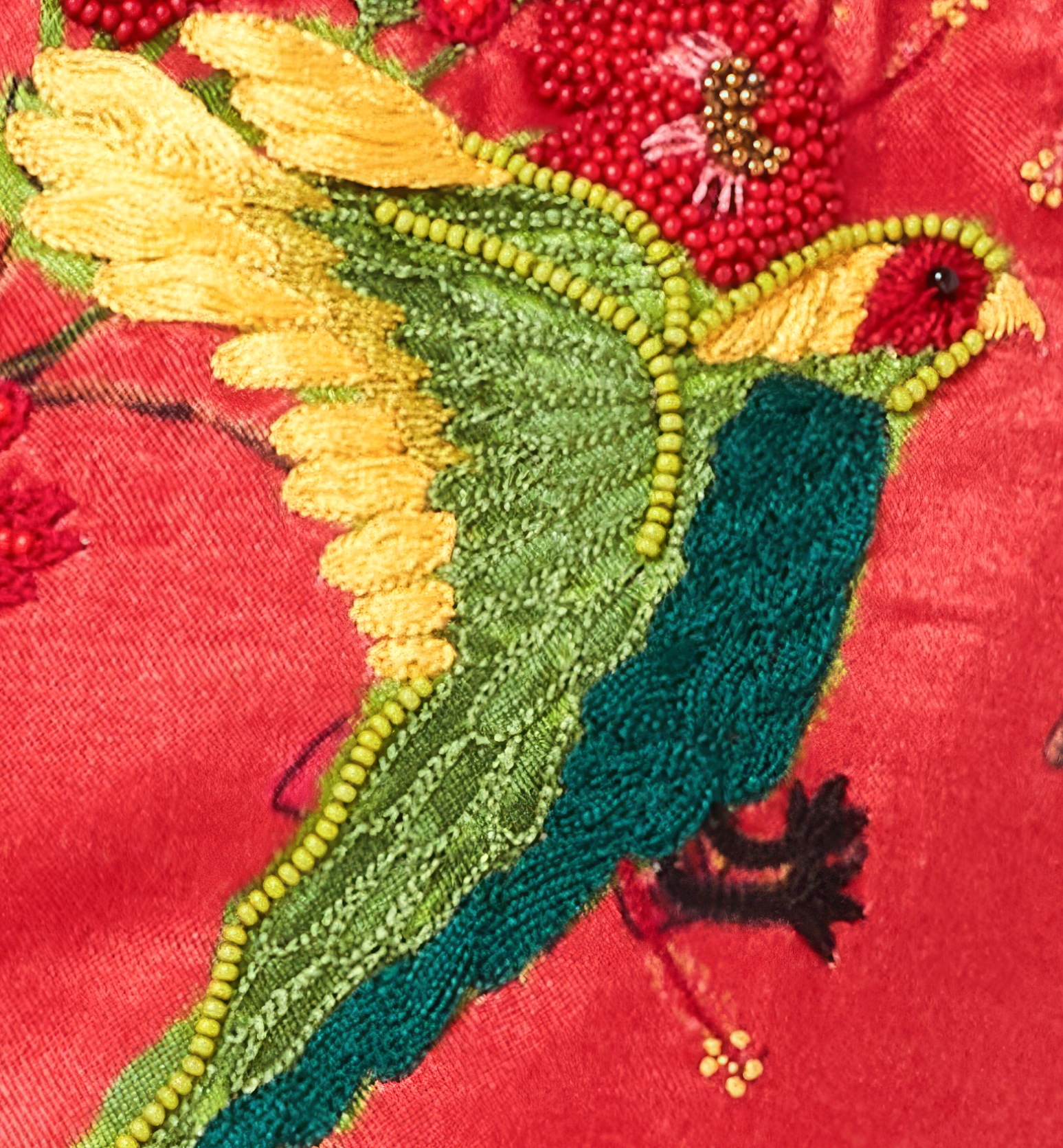 Embroidered Hummingbird on a red background 