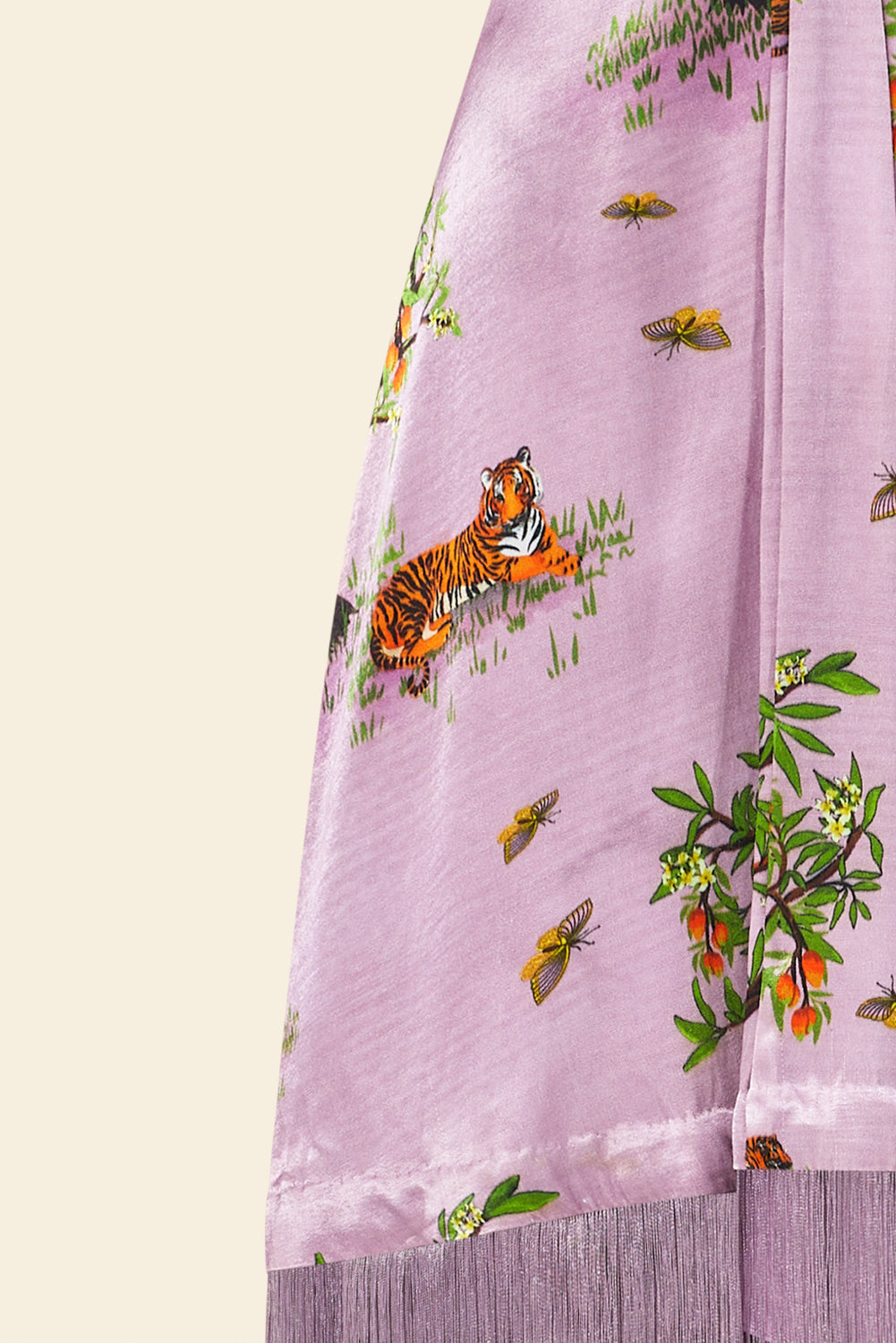 Purple fabric with tiger and butterfly print on a light yellow background