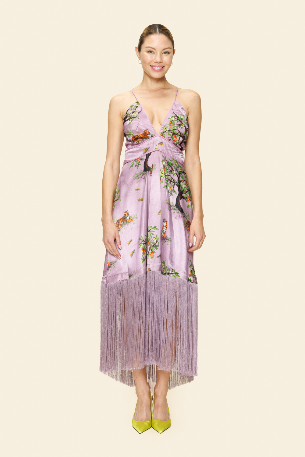 Woman wearing a floral dress on a plain background
