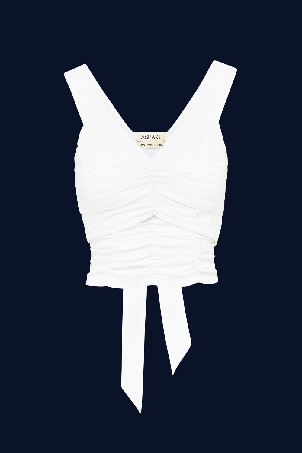White top with a tie on a dark blue background