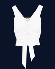 White top with a tie on a dark blue background
