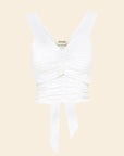 white rouched top on beige background
