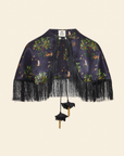 A navy blue fringe cape with a floral pattern and tassel detailing.