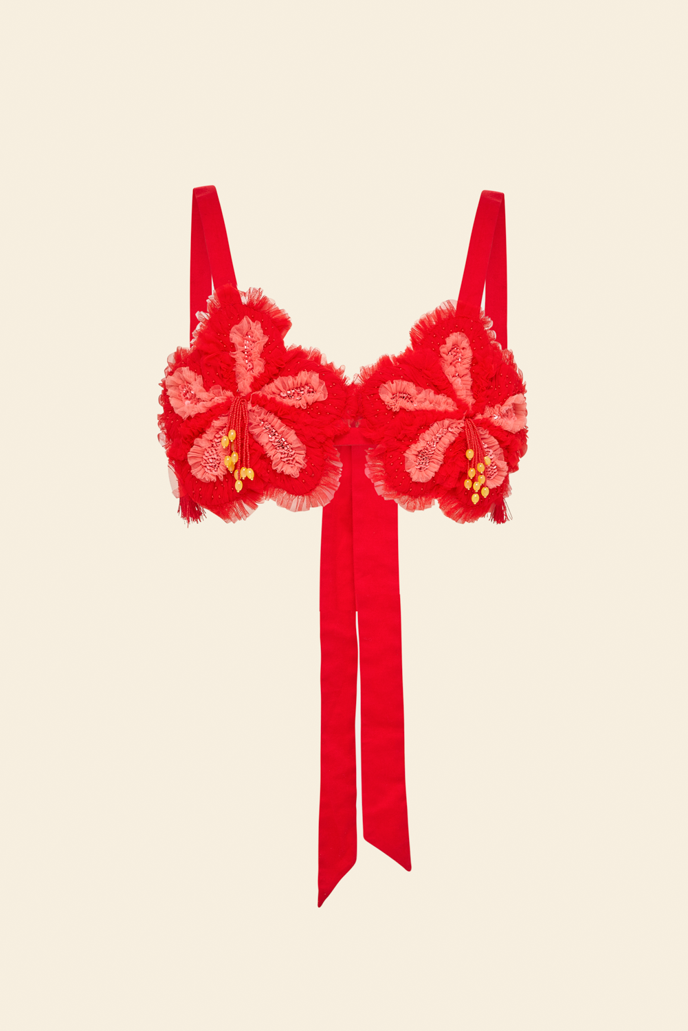 A red beaded hibiscus floral top with tulle ruffles and sequins, featuring adjustable straps and a bow detail at the back.