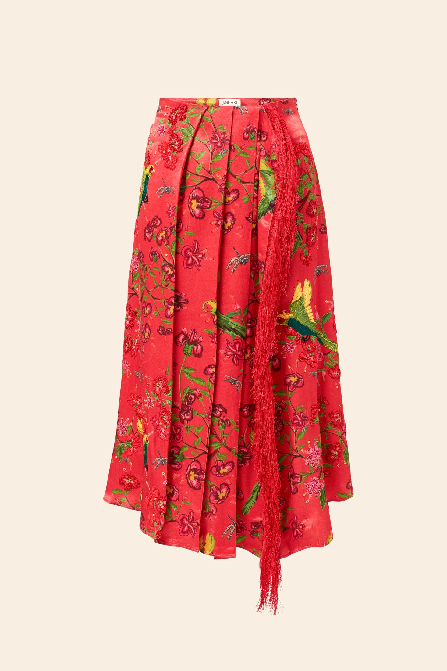 Red skirt with floral and bird pattern on a beige background