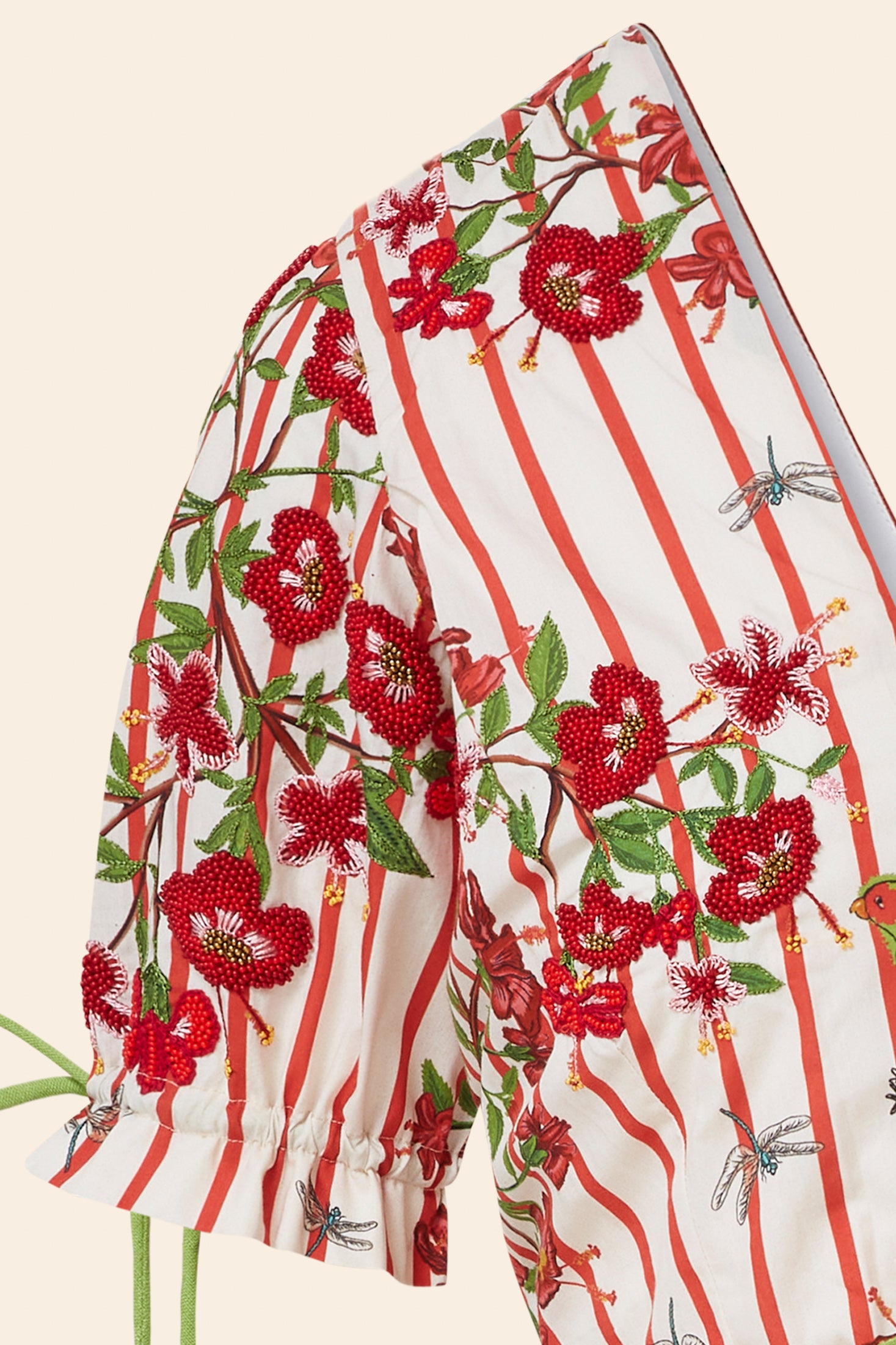 Floral and striped fabric with red flowers and green leaves on a white background