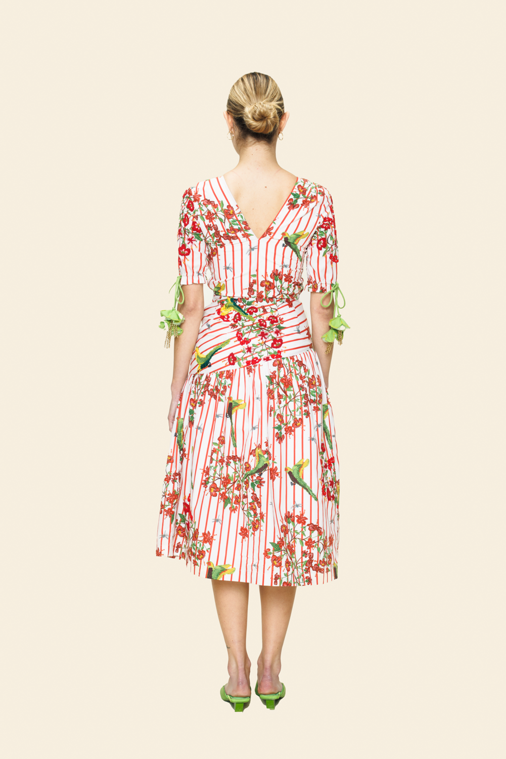 Woman wearing a floral dress with a white background