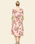 Woman wearing a floral dress with a white background
