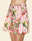 Shorts with parrot and floral pattern on a beige background