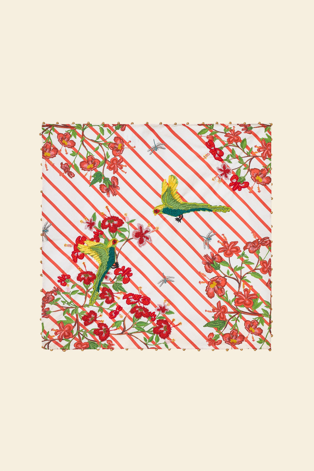 Patterned fabric with red and green design on a beige background
