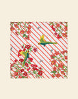Patterned fabric with red and green design on a beige background