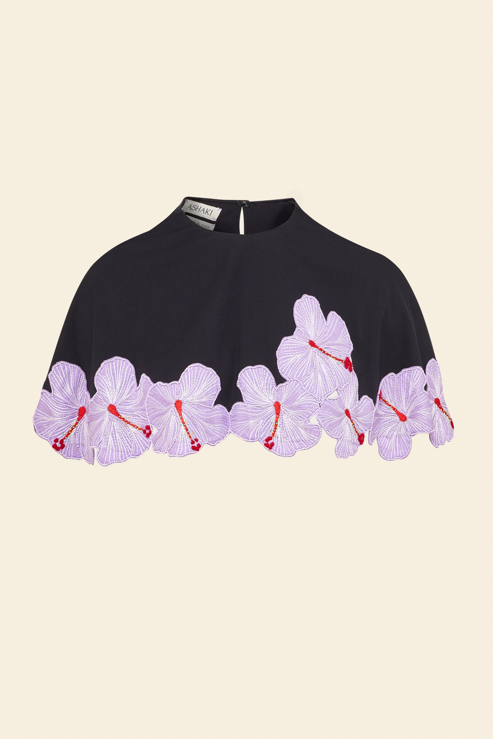 Black cape with purple and pink hibiscus flower applique along the bottom edges