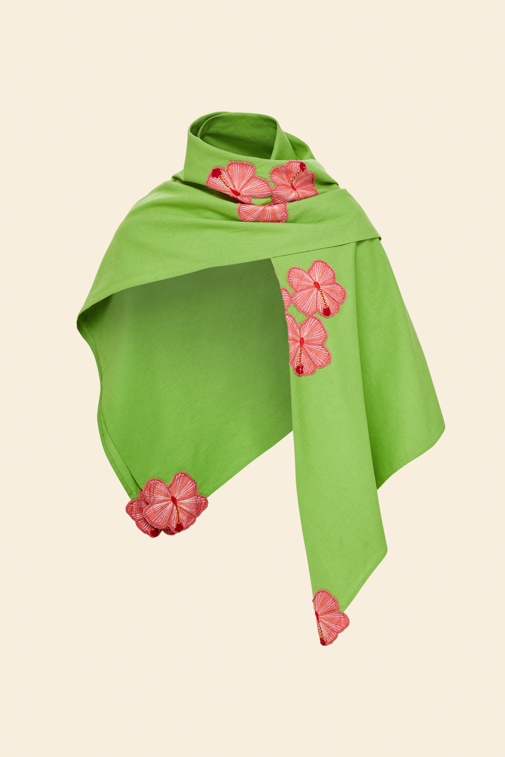 A green linen shawl with pink hand-embroidered hibiscus applique details displayed on a plain background.