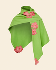 A green linen shawl with pink hand-embroidered hibiscus applique details displayed on a plain background.