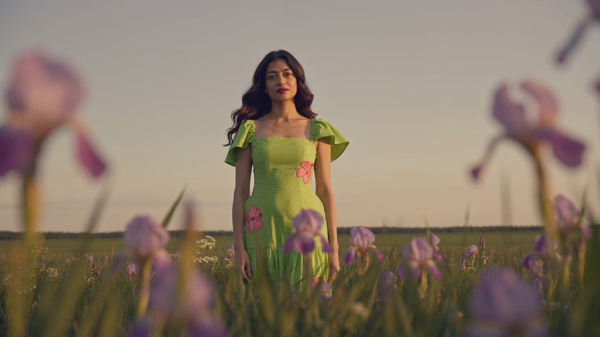 Lady in green dress in field